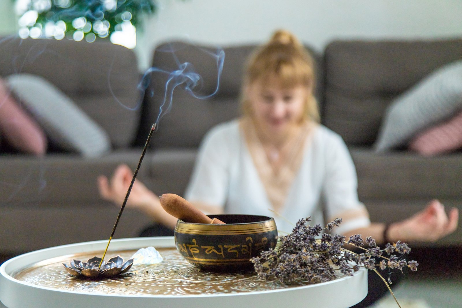 Woman doing yoga at home and aromatherapy. Selective focus.